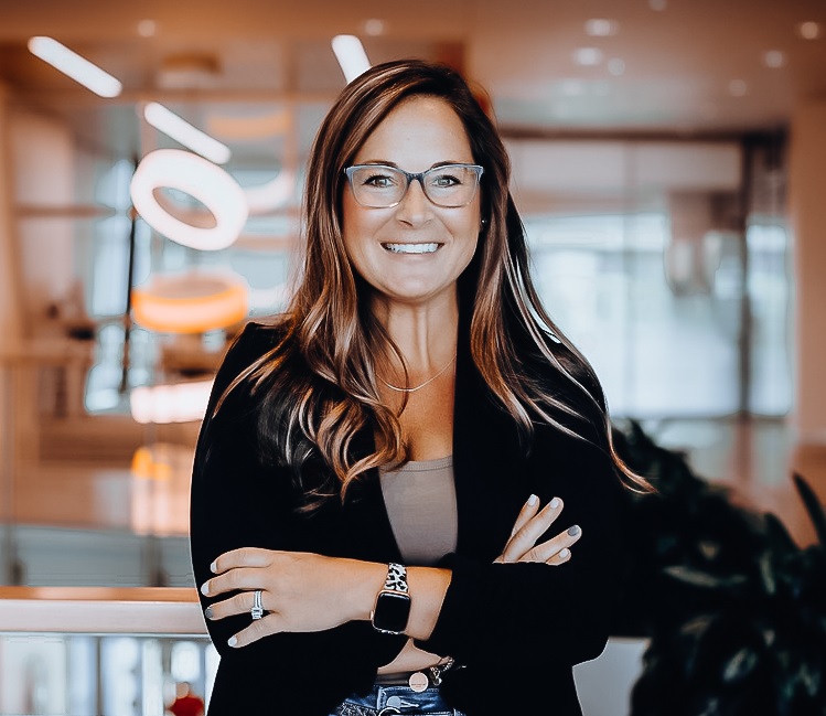 Heather Frye in her signature black blazer and glasses